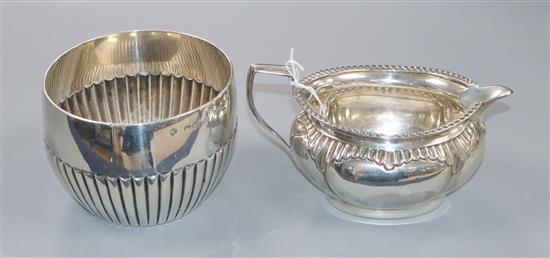 A late Victorian silver sugar bowl, by Walter & John Barnard, London, 1890 and a Victorian silver cream jug, 8 oz.